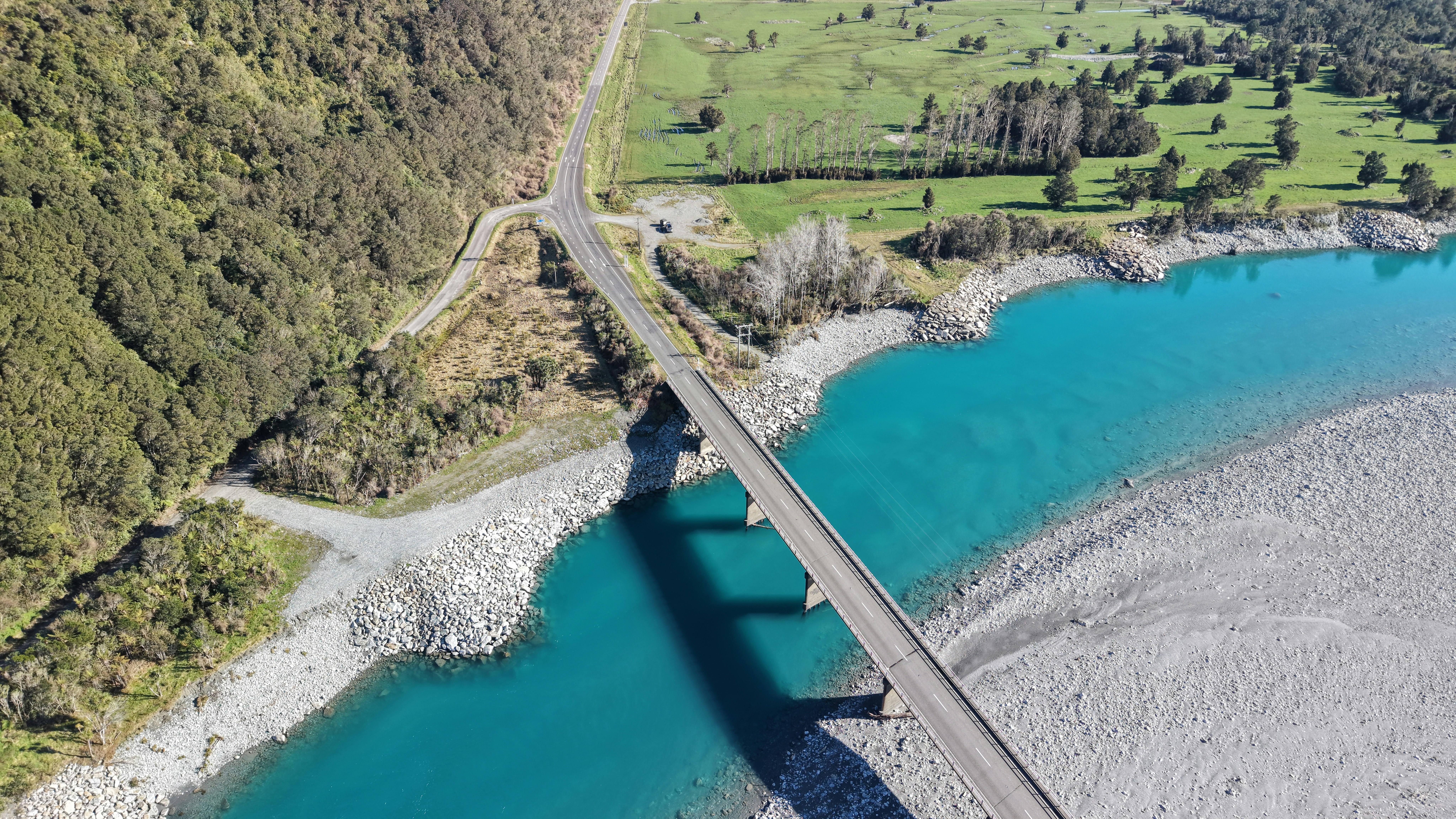 A road bridge crossing the Waitaha River on the West Coast